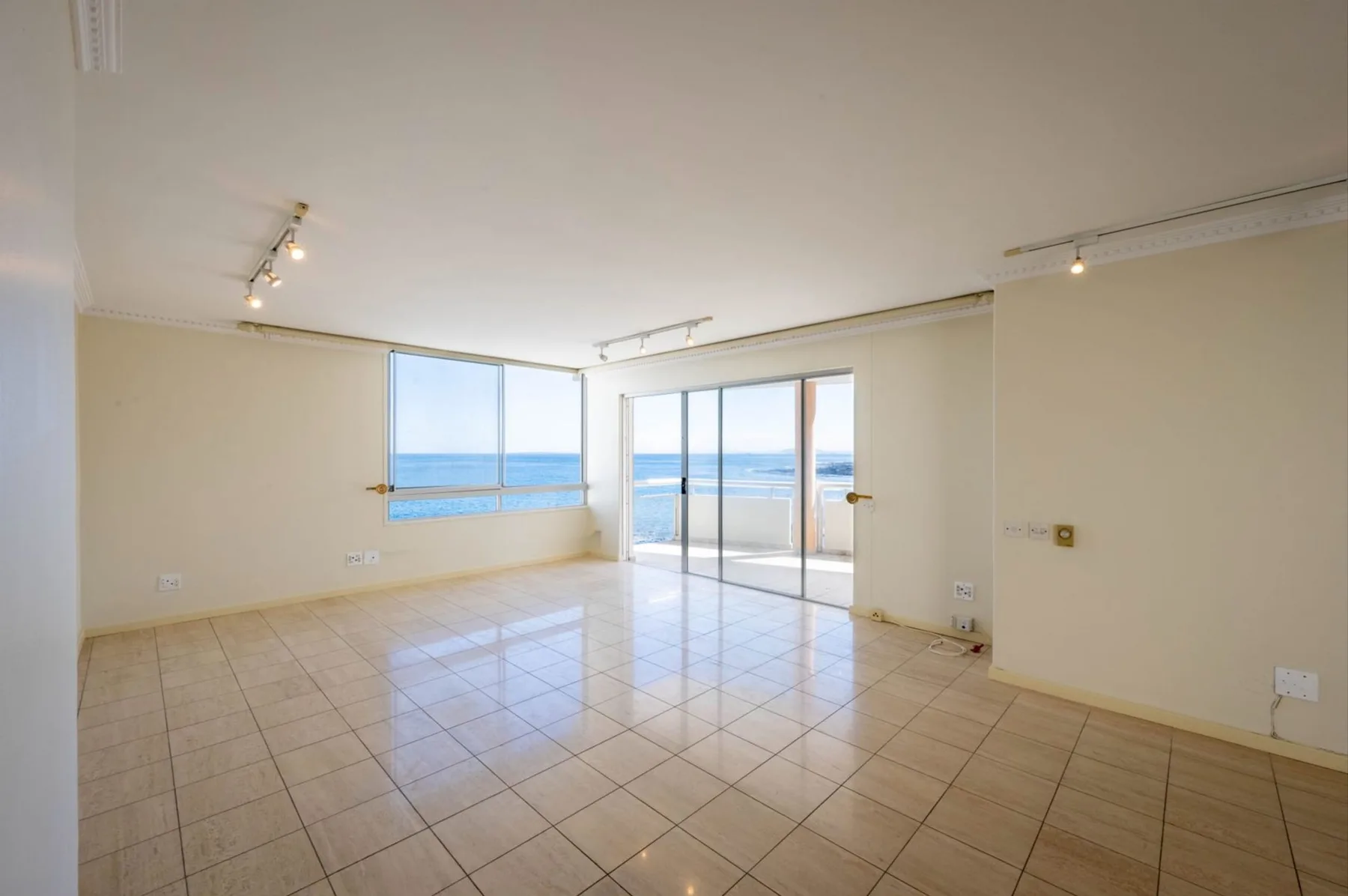 An empty lounge before virtual staging